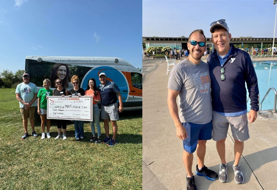 Group holding check and two men smiling